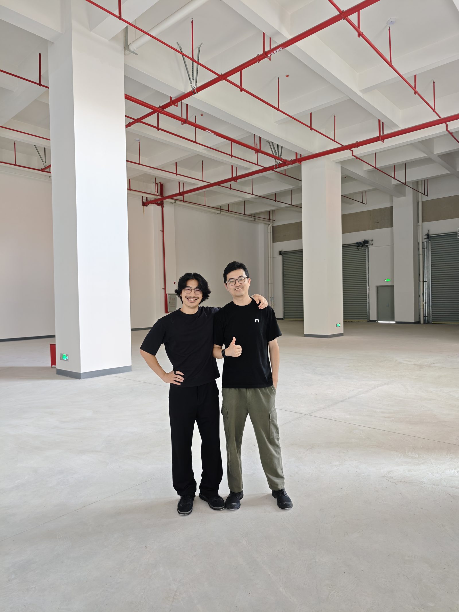 The Yesa cofounders standing in their newly leased brewery space
